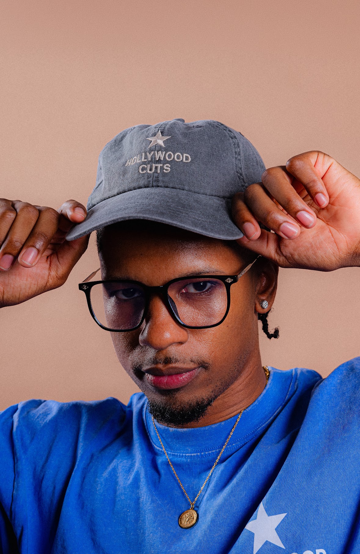 Hollywood Cuts washed charcoal hat worn with the signature shirt