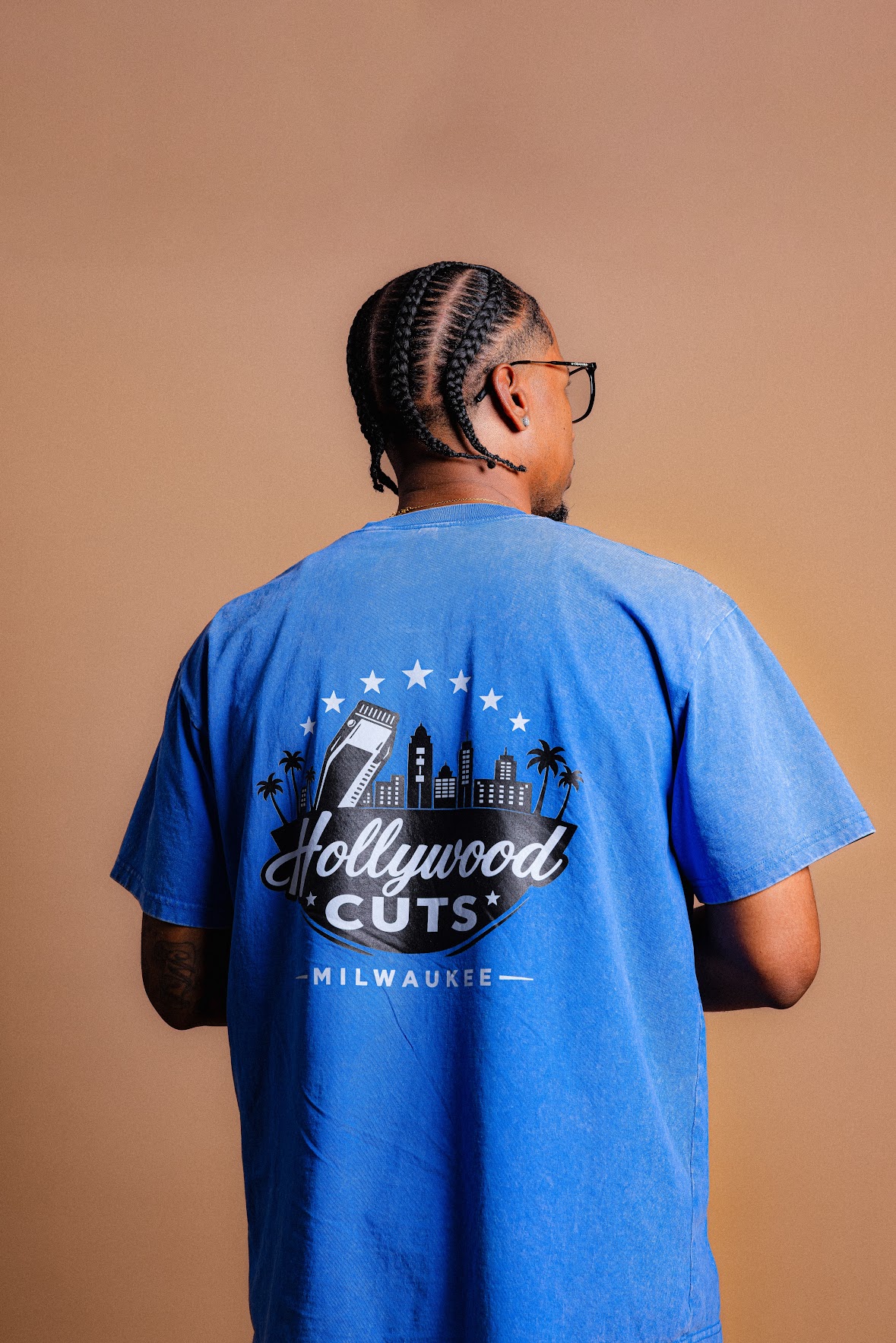 Blue Hollywood Cuts shirt showing the back design